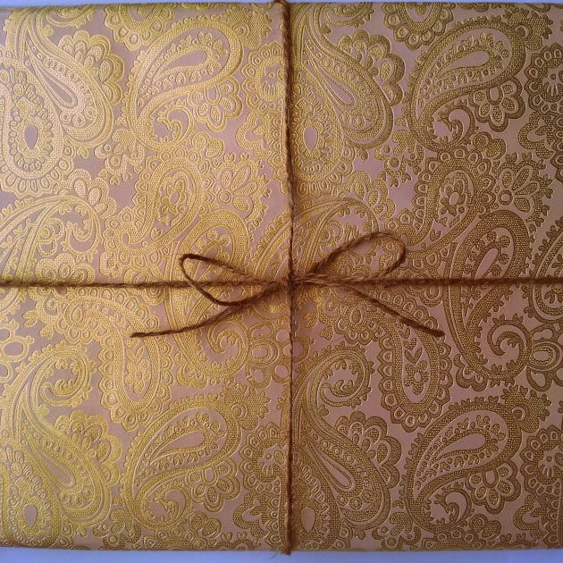 Hubby's graduation gift in my favorite pink and gold wrapping paper and twine. I made him a photobook and on every page is a note from one of the guys in his class, kind of like a yearbook. I thought it would be a good present to help him reminisce down the road
